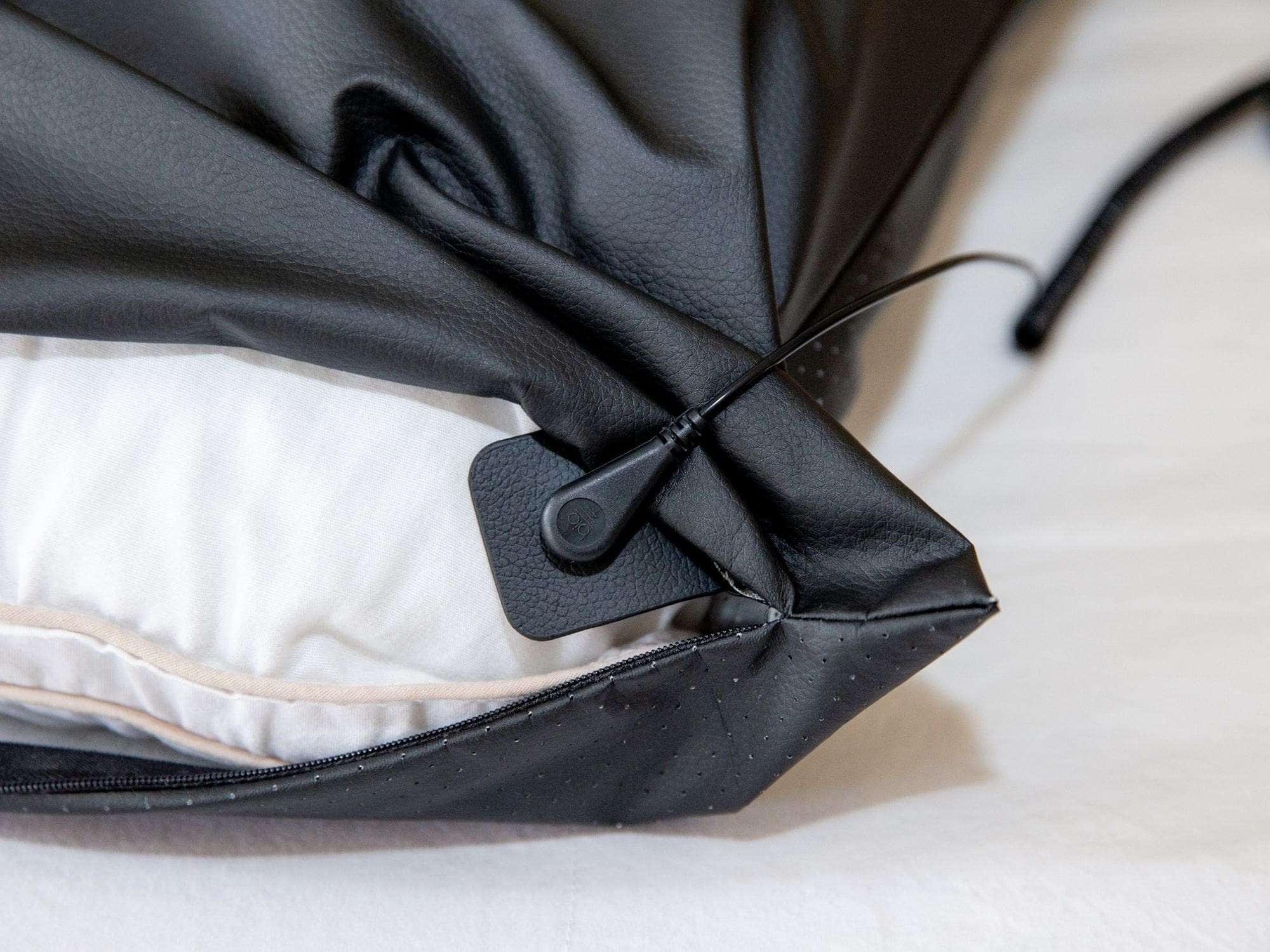 Pillow.Cover.Connected.To.Coil.Cord.Jpg