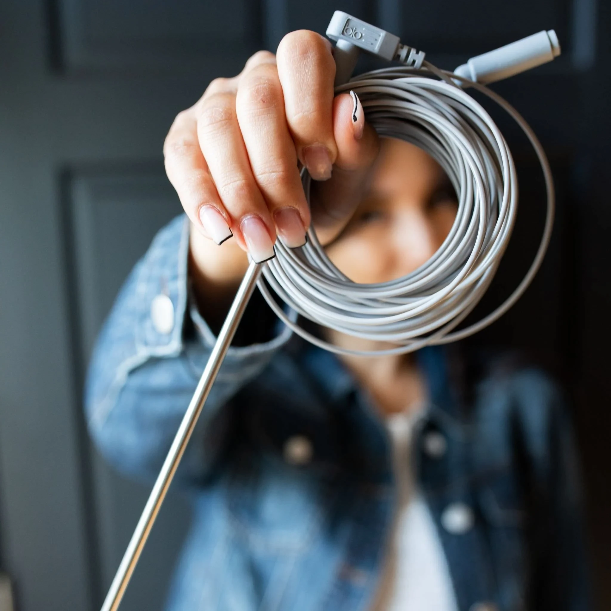 Ground Rod Kit Woman Holding Grounding Rod.Webp